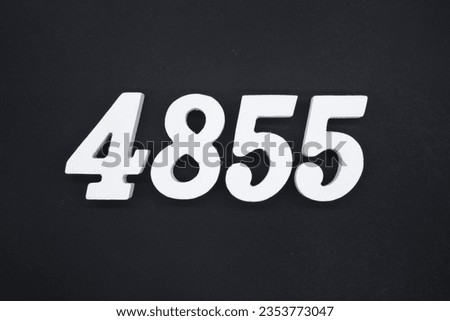 Black for the background. The number 4855 is made of white painted wood.