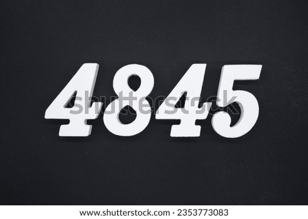 Black for the background. The number 4845 is made of white painted wood.