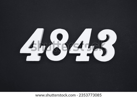 Black for the background. The number 4843 is made of white painted wood.