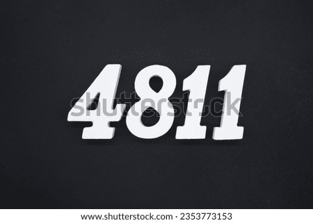 Black for the background. The number 4811 is made of white painted wood.