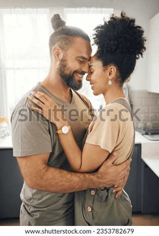 Interracial couple, hug and forehead touch in kitchen, love and bonding with happiness while at home. Trust, support and commitment, affection and embrace with people in a healthy relationship Royalty-Free Stock Photo #2353782679