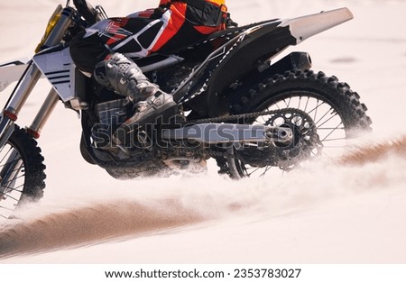 Sports, speed and person on motorbike in desert for training, workout and challenge on sand. Extreme transport, travel and cyclist with motorcycle in action for adventure, freedom and adrenaline Royalty-Free Stock Photo #2353783027