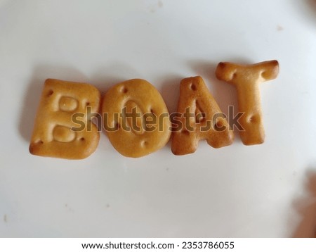 Alphabet Biscuits Symbol - BOAT . Cookie alphabet symbols BOAT isolated on white background. AOAT from full alphabet set