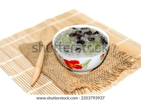 Dessert with Pandan Sago Pudding with Coconut and Palm Sugar put on white background with isolated picture.
