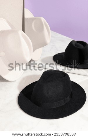 Fedora Hat. Fedora Hat background. Unisex Wide Brim Fedora Hats with Belt Buckle. Panama Trilby Hat. Headdress, Headgear, Head Wear. Fashionable Hats. stylish hats. Royalty-Free Stock Photo #2353798589