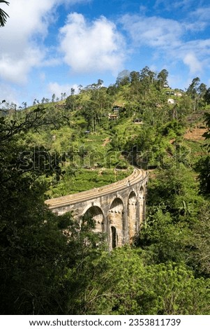 Famous Nine Arch Bridge on a sunny day in Ella, train journey Sri Lanka Royalty-Free Stock Photo #2353811739