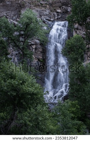 Ethereal beauty in nature: Bridal Veil Falls cascades amidst Spearfish Canyon.