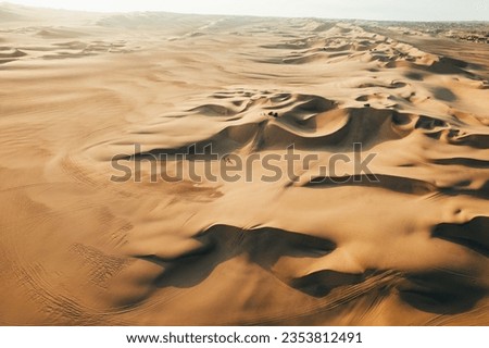 Aerial sunset photo of desert textures in Huacachina, Ica, Peru, South America