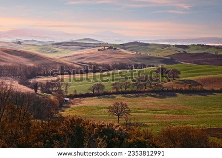 Siena, Tuscany, Italy: landscape at sunrise of the Val d'Orcia countryside and the picturesque colorful hills

 Royalty-Free Stock Photo #2353812991
