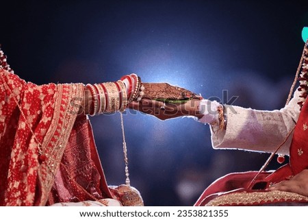 Indian wedding rituals Hastmelap A Candid moment 
bride groom hand picture
back light effect in background