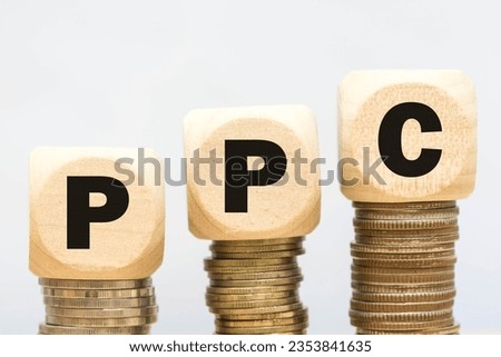 Wood cube stack alphabet PPC abbreviation on white background.
Pay Per Click Advertising website Concept.