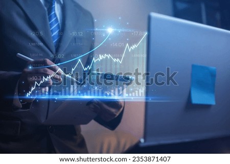 Businessmen use modern online technology laptops, display charts, stock market charts and rising arrows for investments, analyze profits and high dividends in the year of the enterprise. finance