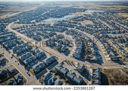 Striking aerial depiction of Stonebridge neighborhood in Saskatoon, melding contemporary urban layout with the gentle embrace of Saskatchewan's green expanses
