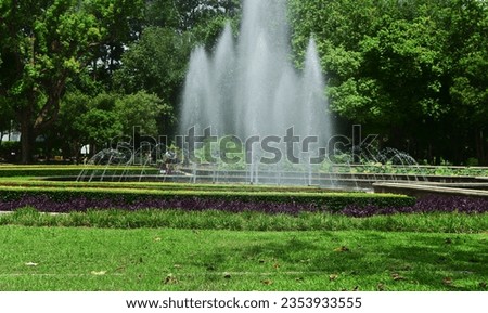 The fountain is a beautiful fountain. in the lawn garden