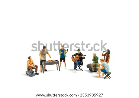Miniature people are making barbeque, drinking beverages, making memories, and laughing isolated on white background Royalty-Free Stock Photo #2353935927