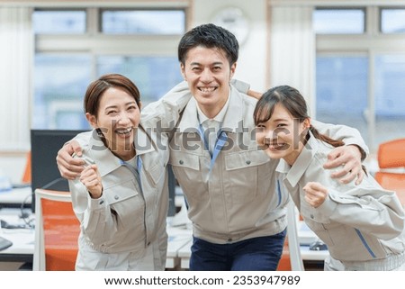 portrait of young asian engineer smiling in office