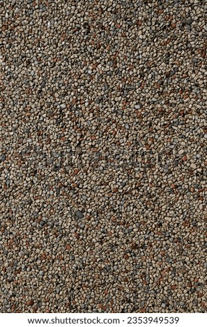Seamless brown and beige mosaic pattern, background. texture to create rough  from small particles of round stones. backdrop for design. flooring tiles. 