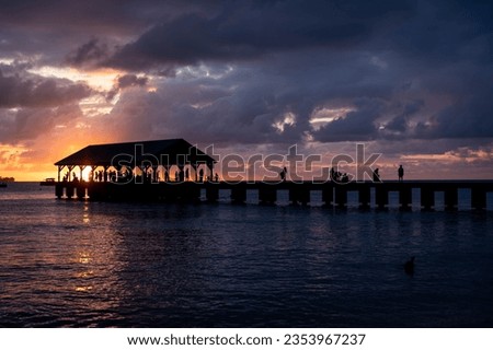 Hanalei Pier after sunset with dramatic skies in the background, Northern Shore of Kauai, Hawaii