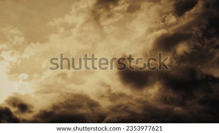 Overcast background with light autumn sunset gradient dark golden brown tones. For backdrop cloudy sky weather clouds  Royalty-Free Stock Photo #2353977621
