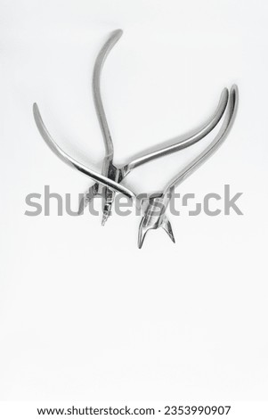 orthodontic pliers isolated on white background, copy space, dental technician concept dental tools