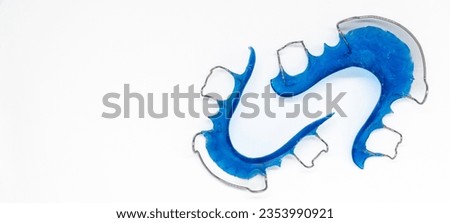 Blue hawley retainers, acrylic retainer, dental technician concept, selective focus, copy space, banner for web use