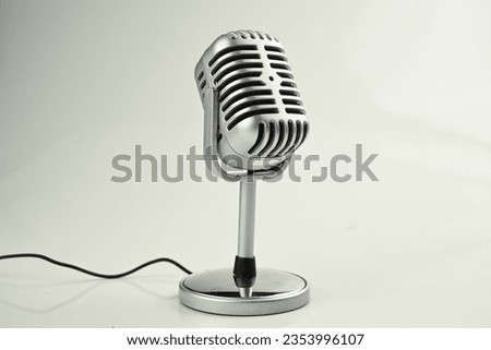 vintage mic commonly used in the world of broadcasting for radio broadcasts and in the world of entertainment for playing music and presenters with a plain white background