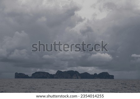 Cloudy weather at sea. Big storm over the ocean. Islands. Thunderclouds.