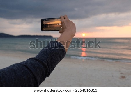 Keep memories and impressions from the camera in the sunset atmosphere at the seaside.