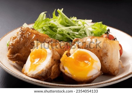 
Image of soft-boiled egg wrapped in meat