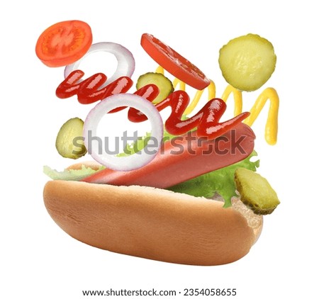 Hot dog ingredients in air on white background Royalty-Free Stock Photo #2354058655