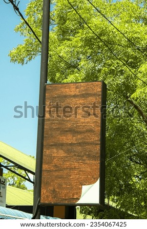 Blank wood sign board in the park for text and advertising.