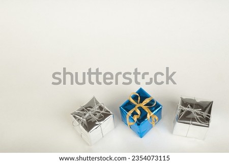 colorful wrapped gift boxes, on isolated background. Beautiful present box with overwhelming bow. Christmas surprise icon. Happy new year decor, discounts, promotions.