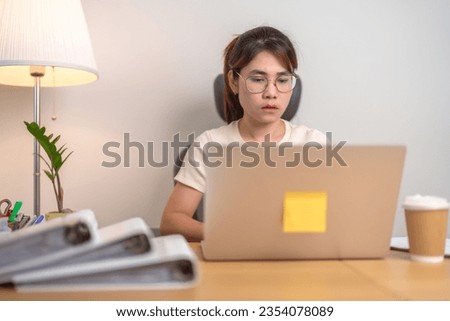 stressed Asian Woman using laptop, Tired female businesswoman working overload with headache and Sleepy at office, Exhausted casual woman with computer at late night in home. Work Life Balance concept