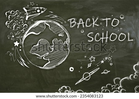 Creative back to school sketch with globe and rocket on blackboard wall wallpaper. Education and knowledge concept