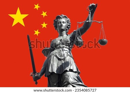 The Justitia, the symbol of justice with sword and scales in front of the Chinese flag. Royalty-Free Stock Photo #2354085727