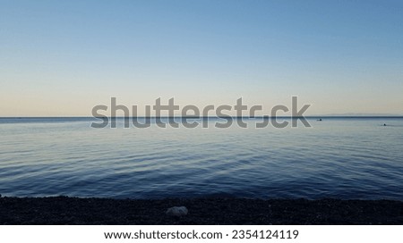 a very calm sea view, during the evening sunset