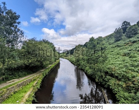 Stunning scenery along the Rochdale canal between Hebden Bridge and Todmorden, taken on an August day Royalty-Free Stock Photo #2354128091