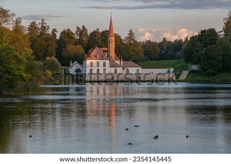 Priory Palace in the evening August landscape. Gatchina. Leningrad region, Russia Royalty-Free Stock Photo #2354145445