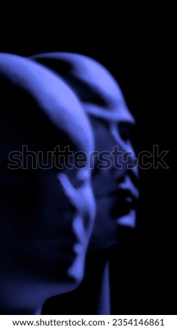 two blurred mannequins heads illuminated by blue theatrical light
 Royalty-Free Stock Photo #2354146861