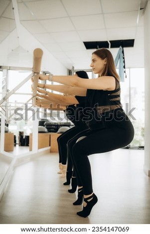 There is group Pilates class in studio for people of different ages. 