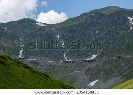 The carpathian mountains with the winding transfaragasan road Royalty-Free Stock Photo #2354158435