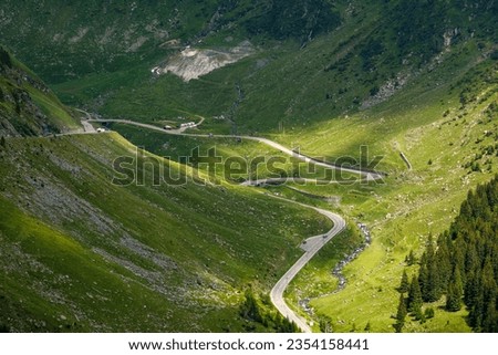 The carpathian mountains with the winding transfaragasan road Royalty-Free Stock Photo #2354158441