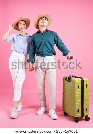 Photo of young Asian couple on background