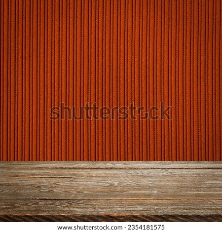 The background is blank wooden boards and a textured striped wall with gradient lighting and vignetting.