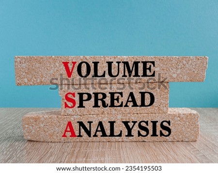 Volume Spread Analysis symbol. Brick blocks with text Volume Spread Analysis. Beautiful blue background. Wooden table. Business and Volume Spread Analysis concept. Copy space.