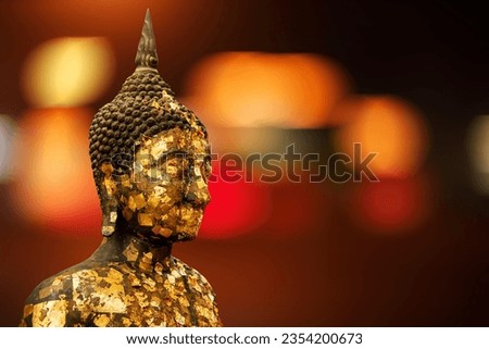 Shadow black Buddha golden you from nature stone ancient ancient times clipping part Powerful, gilded bronze Buddha image. Royalty-Free Stock Photo #2354200673