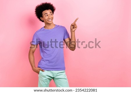Photo of cheerful funky man wear purple stylish outfit recommend clothes collection empty space isolated on pink color background
