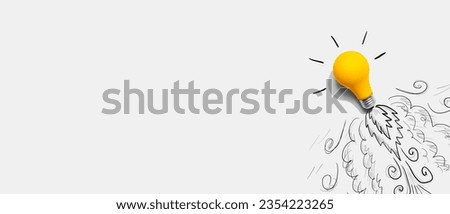 Idea light bulb flying to the sky like a rocket - Flat lay Royalty-Free Stock Photo #2354223265