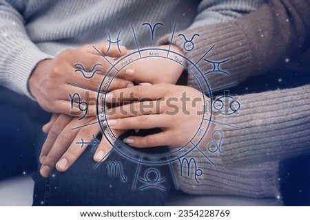 Relationships and horoscope. Zodiac wheel and photo of man and woman holding hands, closeup