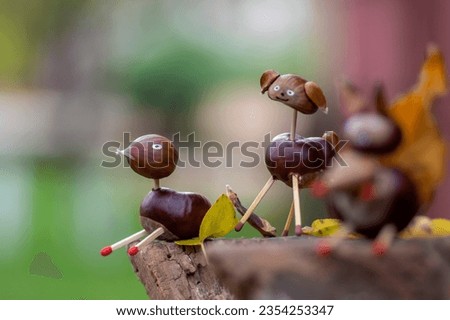 Funny chestnut duck animal with cute face on natural background stump, traditional fall autumnal handcraft with children
